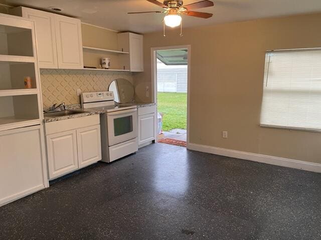 kitchen featuring white cabinets, electric stove, sink, decorative backsplash, and ceiling fan