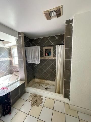 bathroom featuring tile patterned floors and a shower with curtain