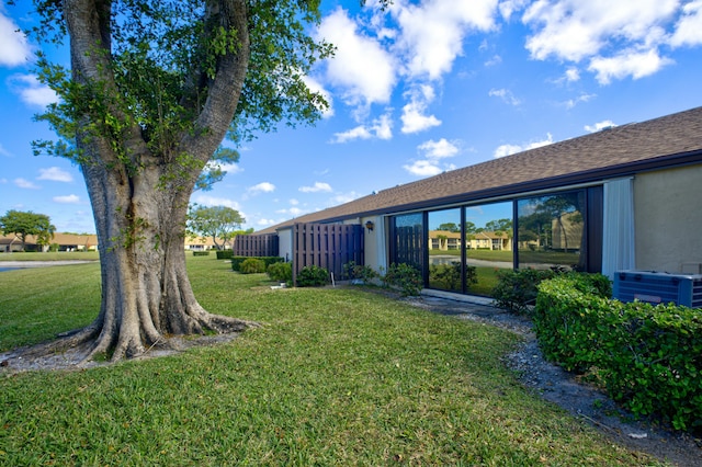 view of yard with central AC