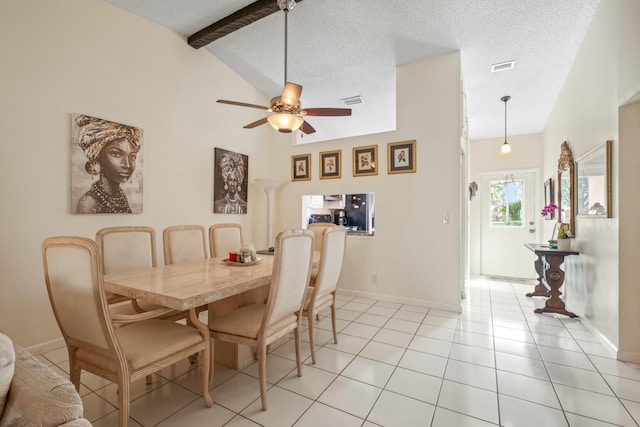 tiled dining area with vaulted ceiling with beams, a textured ceiling, and ceiling fan