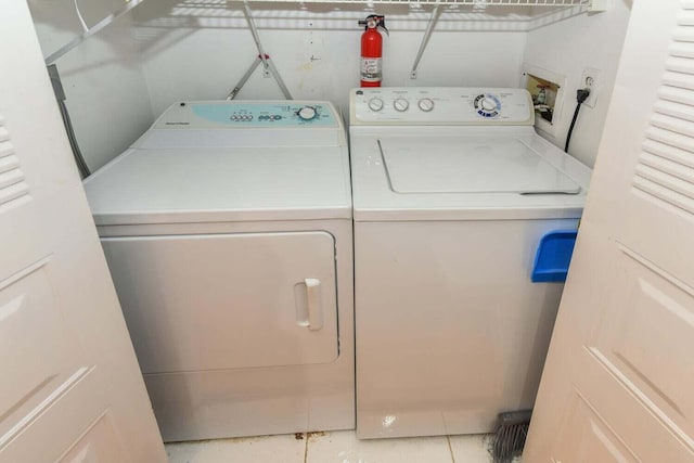 laundry area with washing machine and clothes dryer