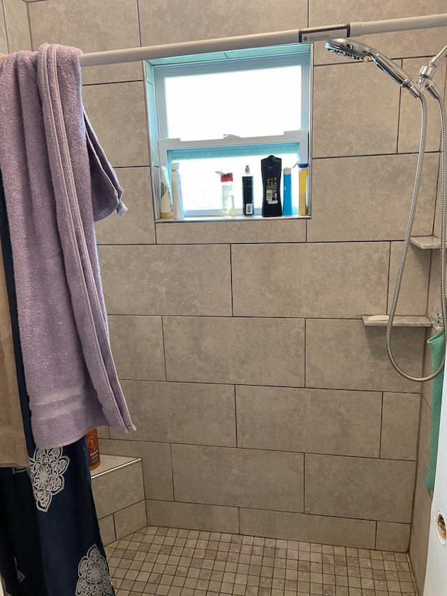 bathroom with a shower with curtain