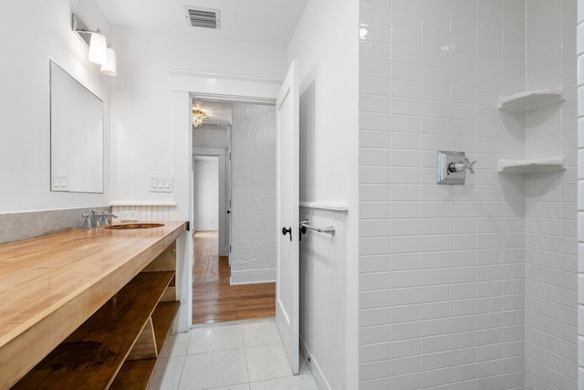 bathroom with hardwood / wood-style flooring and vanity