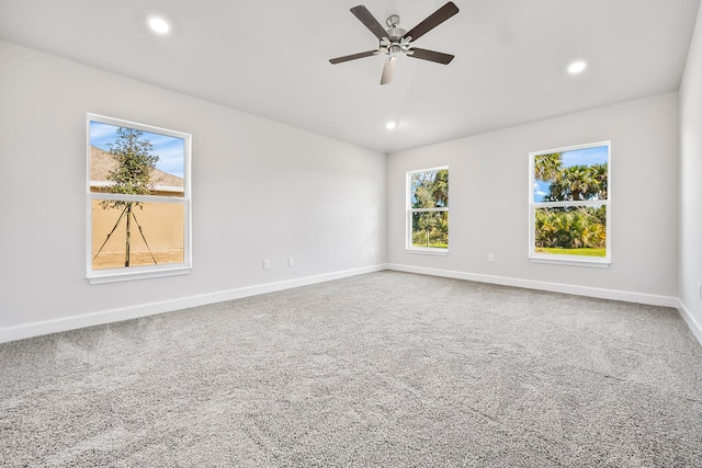 empty room with carpet flooring and ceiling fan