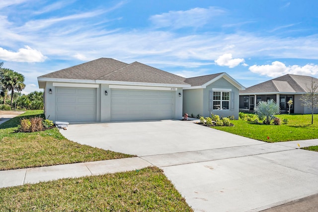 single story home with a garage and a front yard