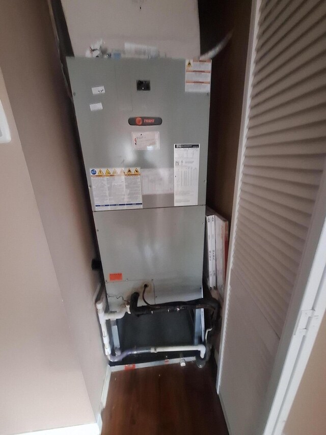 utility room featuring heating unit