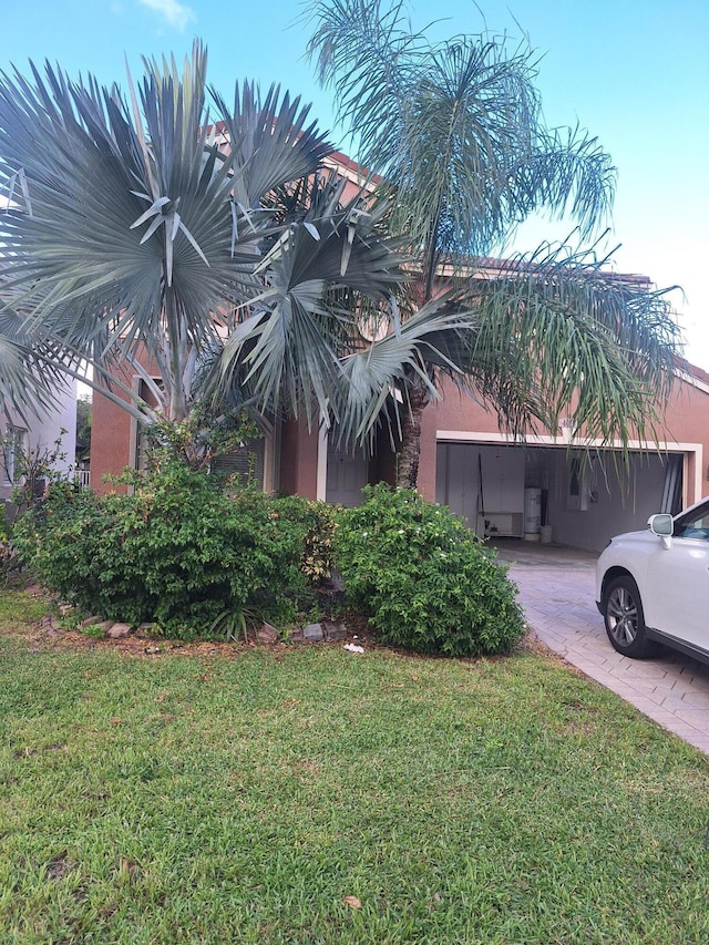 view of side of home with a yard