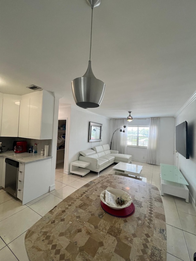 tiled living room with crown molding