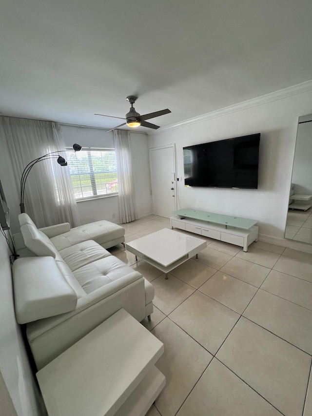 unfurnished living room with light tile patterned floors, ceiling fan, and ornamental molding