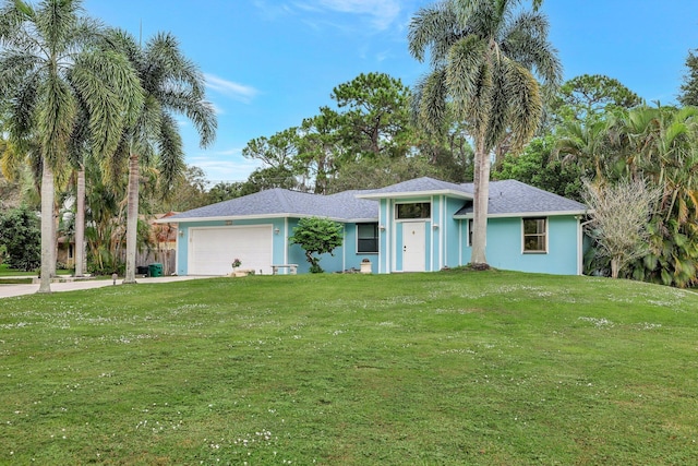 single story home featuring a front yard and a garage