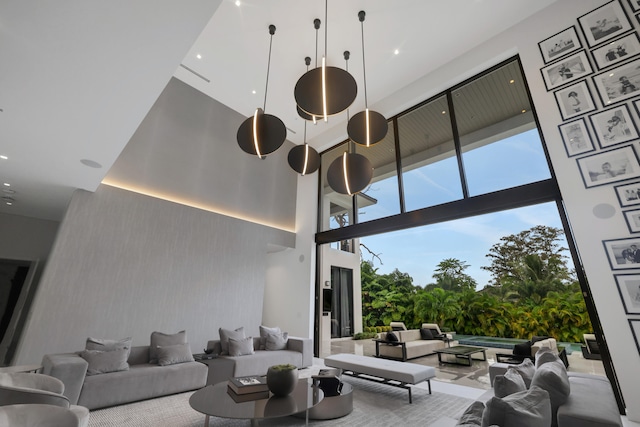 living room with a towering ceiling