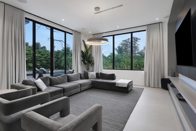 living room with a wall of windows and a wealth of natural light