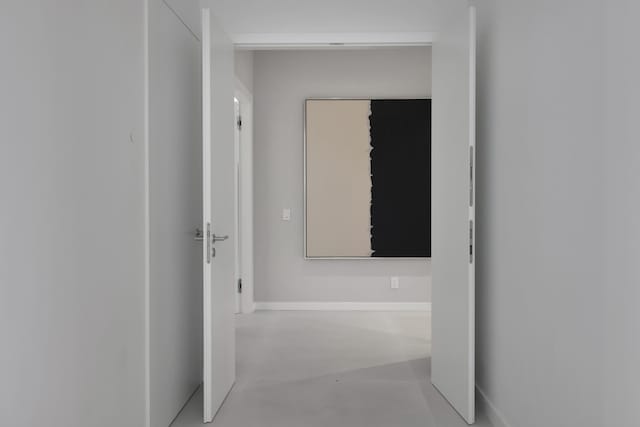 hallway featuring concrete flooring