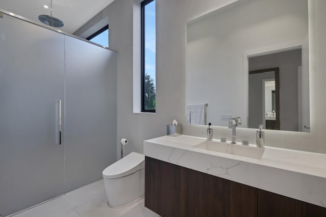 bathroom featuring tile patterned flooring, vanity, and toilet