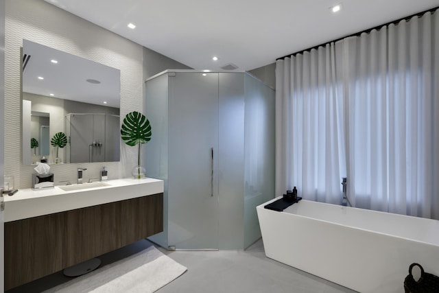 bathroom featuring vanity, decorative backsplash, plus walk in shower, and concrete floors