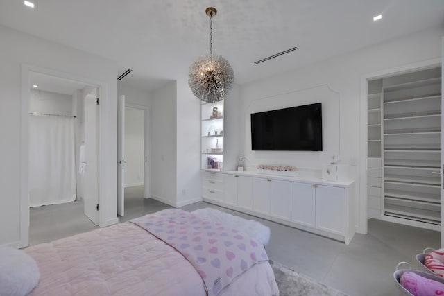 bedroom with a chandelier