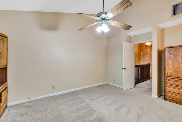 interior space with ceiling fan and vaulted ceiling