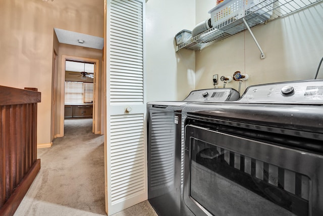 clothes washing area with light carpet, independent washer and dryer, and ceiling fan