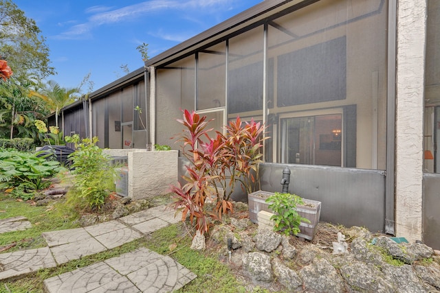 view of home's exterior featuring a sunroom