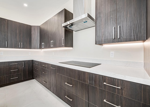 kitchen with black electric stovetop, dark brown cabinetry, light tile patterned floors, and wall chimney exhaust hood