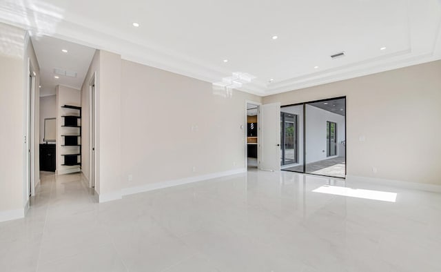 unfurnished room featuring ornamental molding