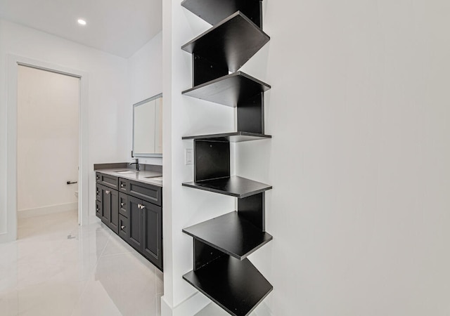 interior space featuring sink and light tile patterned floors