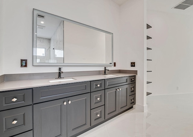 bathroom featuring tile patterned flooring and vanity