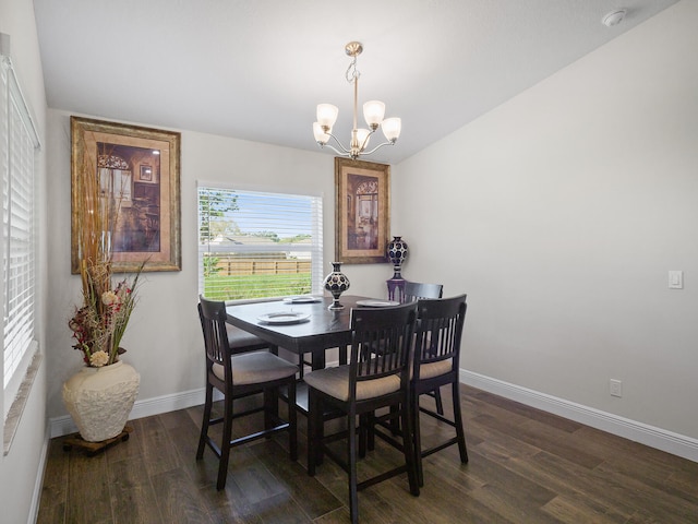 dining space with a chandelier and dark wood-type flooring