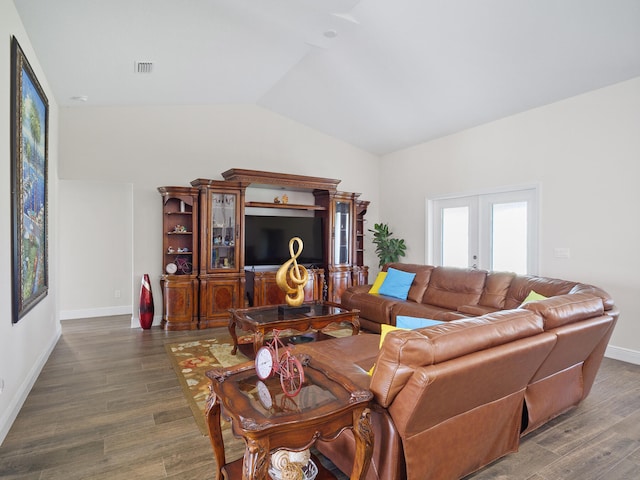 living room with french doors, dark wood-type flooring, and lofted ceiling