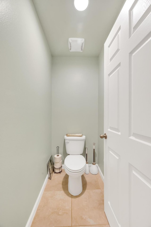 bathroom featuring tile patterned floors and toilet