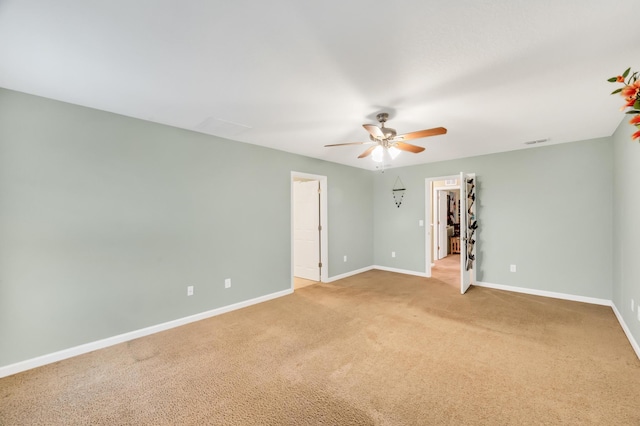 empty room with carpet floors and ceiling fan