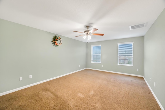 unfurnished room with carpet and ceiling fan