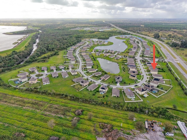 birds eye view of property featuring a water view