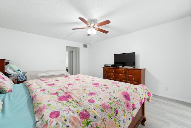 7579 NW 79th Ave Unit 201, Tamarac, FL 33321 - bedroom featuring light wood-style floors, baseboards, and ceiling fan