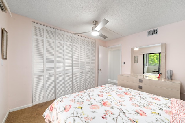 7579 NW 79th Ave Unit 201, Tamarac, FL 33321 - bedroom featuring ceiling fan, a textured ceiling, carpet, visible vents, and a closet