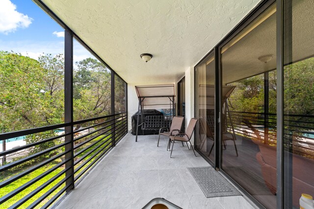 sunroom / solarium featuring a healthy amount of sunlight