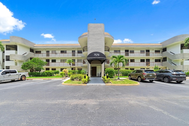 7579 NW 79th Ave Unit 201, Tamarac, FL 33321 - view of apartment building / complex with uncovered parking