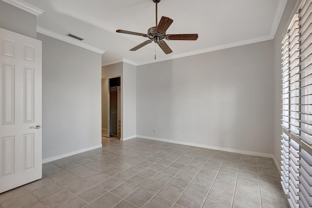 unfurnished room featuring ceiling fan, crown molding, and light tile patterned flooring