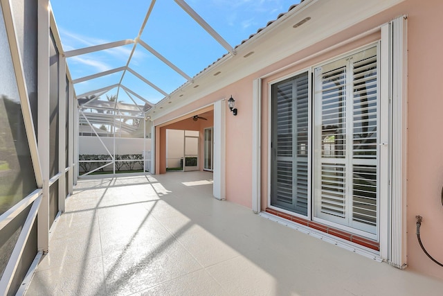 unfurnished sunroom featuring vaulted ceiling