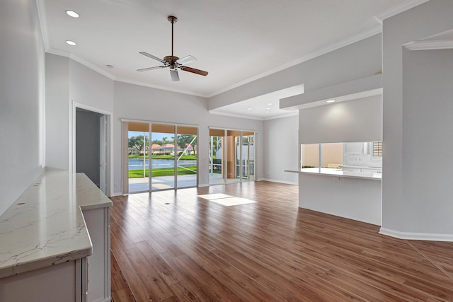 unfurnished living room with ceiling fan, crown molding, and light hardwood / wood-style floors