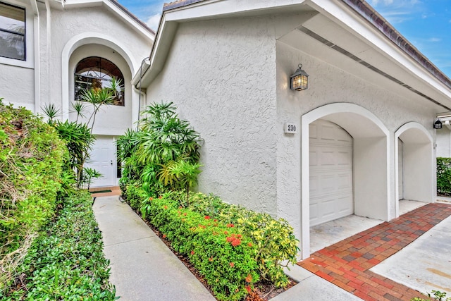 property entrance with a garage