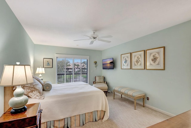 carpeted bedroom featuring ceiling fan and access to outside