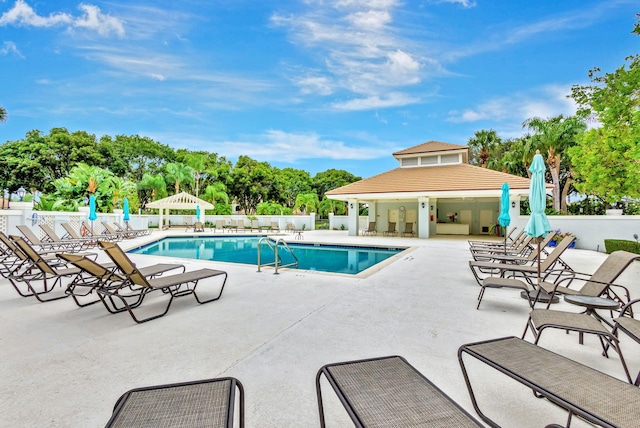 view of swimming pool with a patio