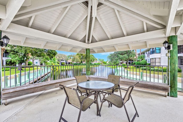 view of patio / terrace featuring a gazebo and a water view