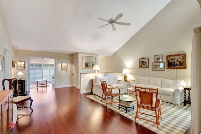 living room with dark hardwood / wood-style floors, ceiling fan, and high vaulted ceiling