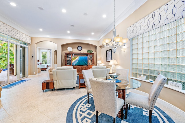 dining room with an inviting chandelier and crown molding