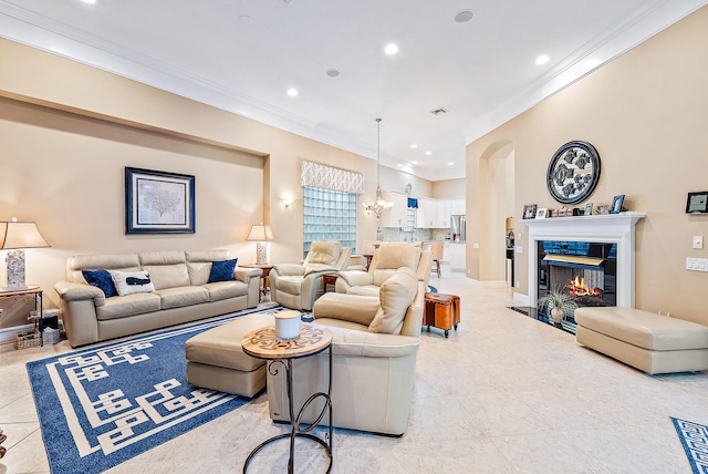 living room featuring ornamental molding and a chandelier