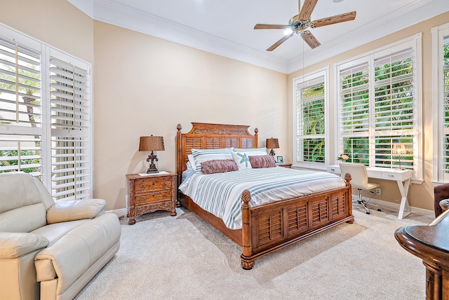 carpeted bedroom with multiple windows, ceiling fan, and ornamental molding