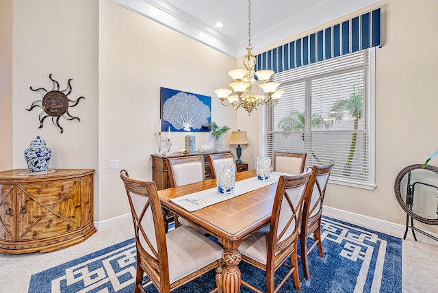 dining space featuring carpet floors, an inviting chandelier, and crown molding