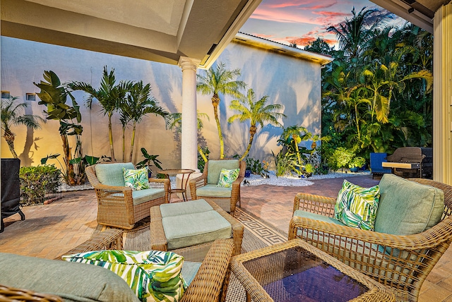 view of patio terrace at dusk